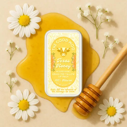 Texas Honey tallow lip balm with honey and daisies on a beige background