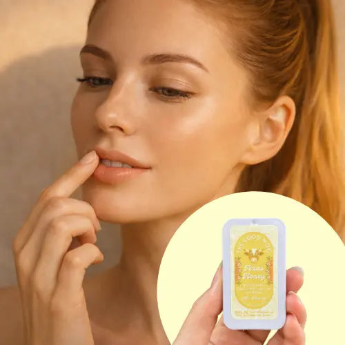 Woman with hydrated holding a lip care product labeled 'Texas Honey Tallow Lip Balm'.